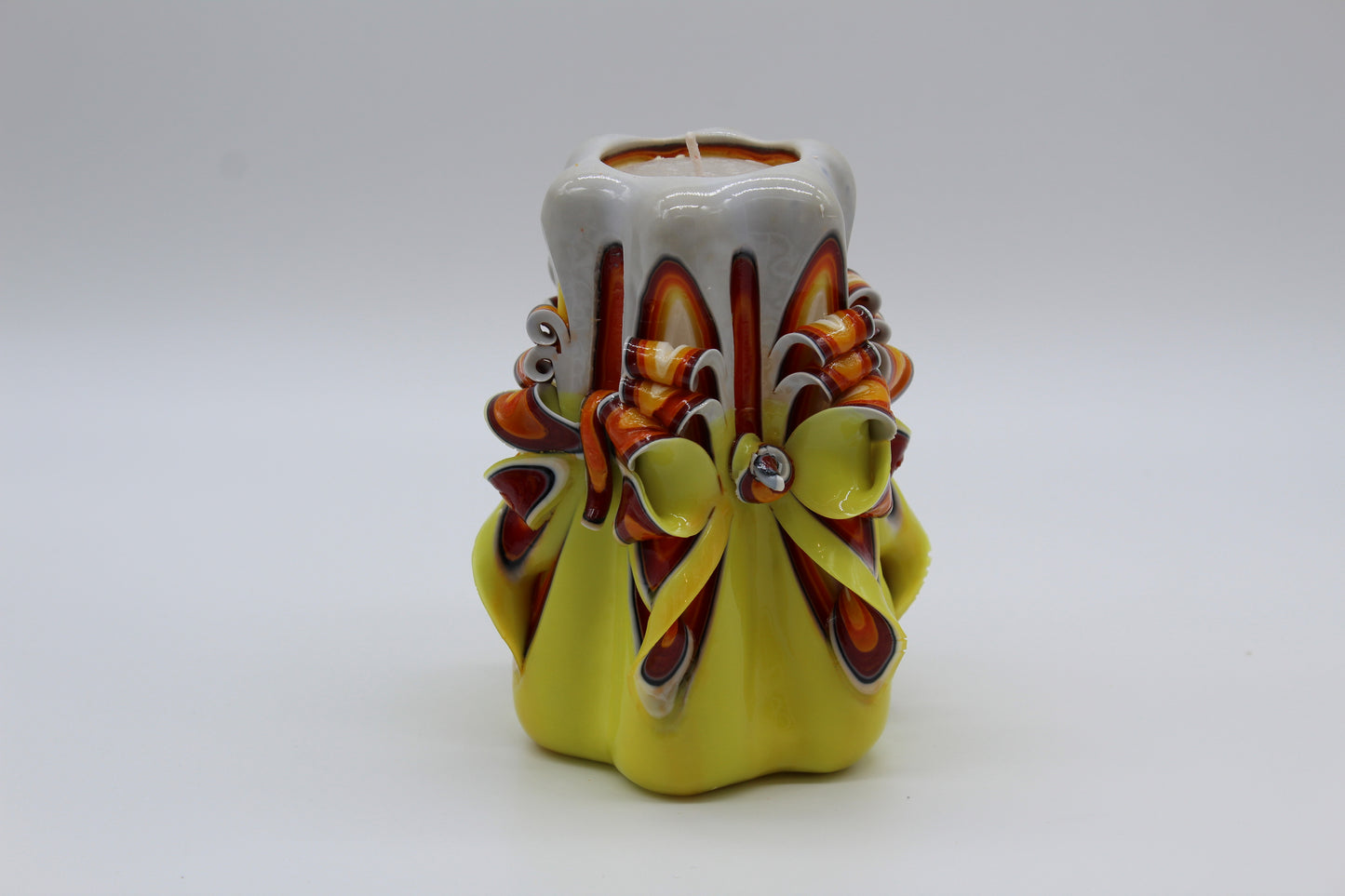 "Classic" yellow and white carved candle