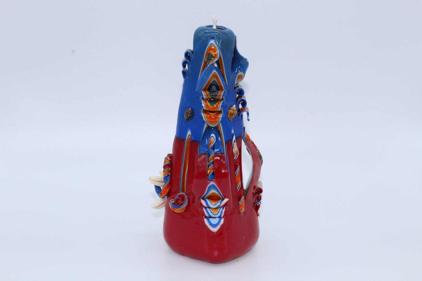 Red and blue "sea" carved candle