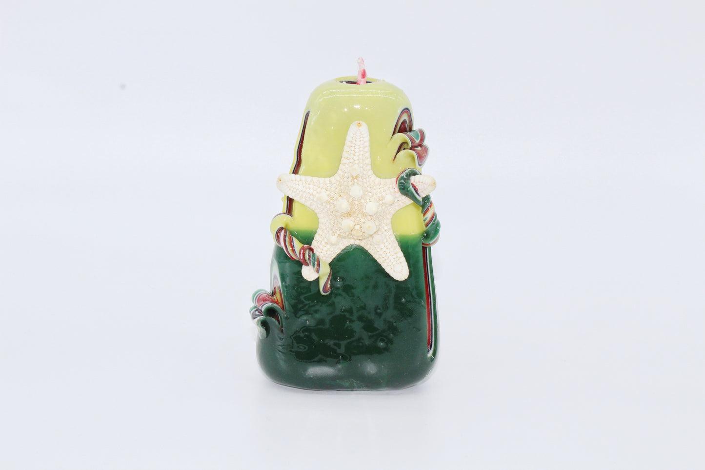 Green and yellow "sea" carved candle
