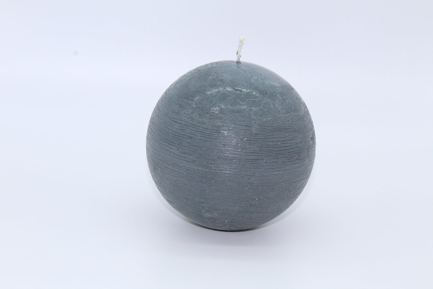 Gray sphere rough effect candle