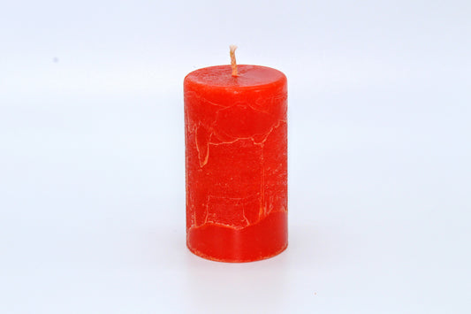 Orange cylindrical raw effect candle