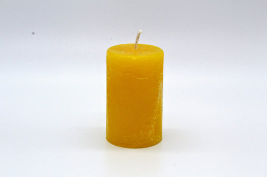 Yellow cylindrical raw effect candle