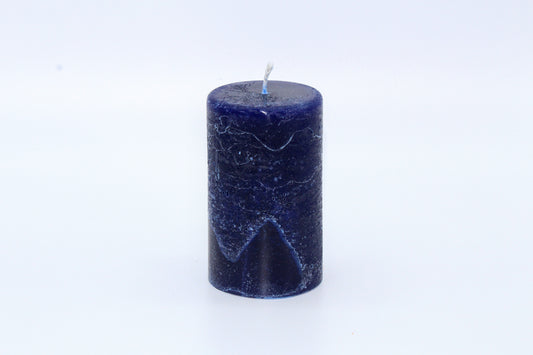 Blue cylindrical rough effect candle