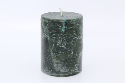 Dark green cylindrical raw effect candle