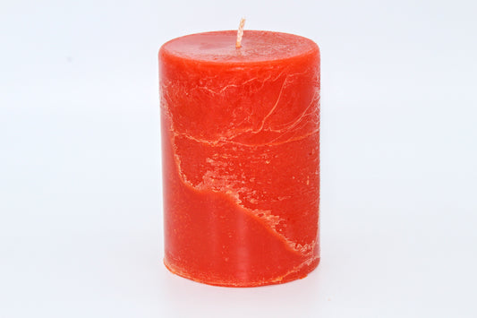 Orange cylindrical raw effect candle