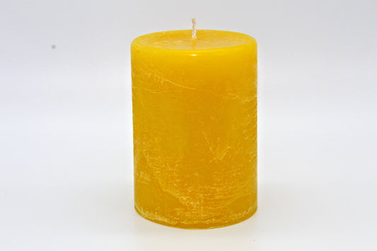 Yellow cylindrical raw effect candle