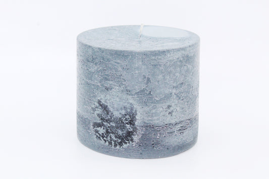 Gray cylindrical raw effect candle