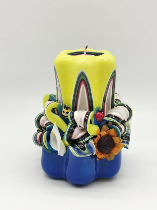 Blue and yellow "spring" carved candle