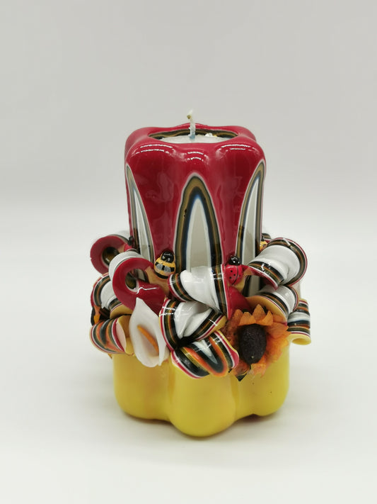 Yellow and red "spring" carved candle