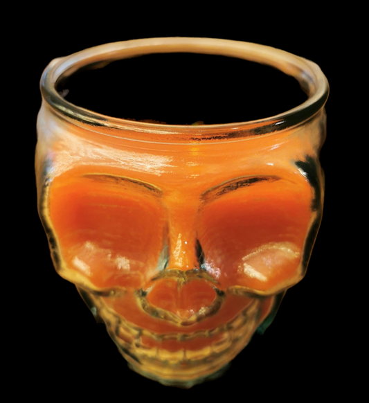 Skull Candle arancione in bicchiere